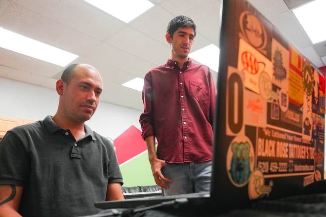 Sergio Romero and William Welsh show their app, Scamkick at New Mexico State University Campus in Las Cruces on Tuesday, Sept. 10, 2019.