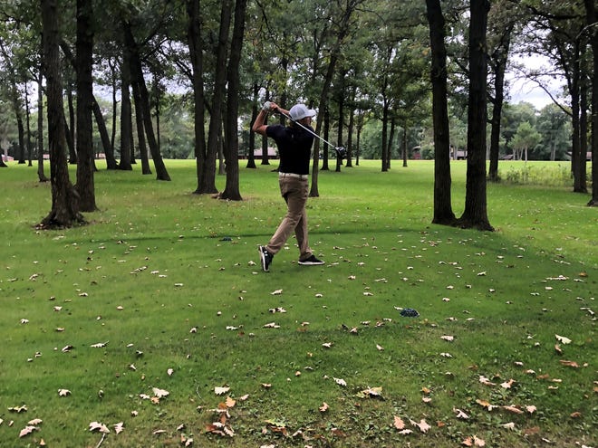 Robert Bell tees off on hole #14 at Wapicada Golf Club.