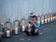 Blake Catanese, 2, sits among 40 luminaria lit at the Flight 93 Memorial Wall of Names on the evening of Tuesday, September 10, 2013, one candle for each passenger or flight crew member aboard United Flight 93 on September 11, 2001. 