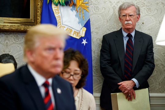 Then-national security adviser John Bolton watches as President Donald Trump meets with South Korean President Moon Jae-in on May 22, 2018.