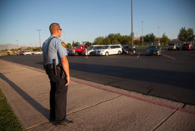 Lt. Ivor Fuller of the St. George Police Department stands outside Snow Canyon Middle School as students arrive Wednesday, Sept. 11, 2019. Local law enforcement will have an increased presence at area schools in response to a text thread that threatened a school shooting. 