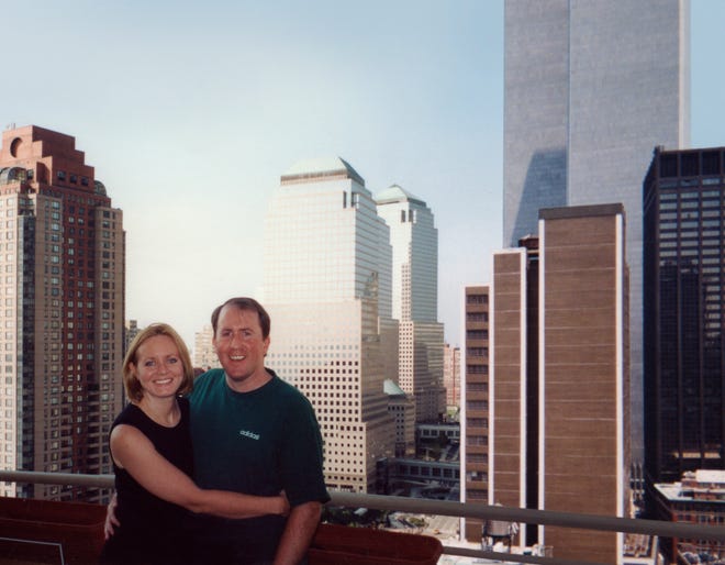 Christina Stanton poses with her husband, Brian Stanton, in front of the Twin Towers in New York.