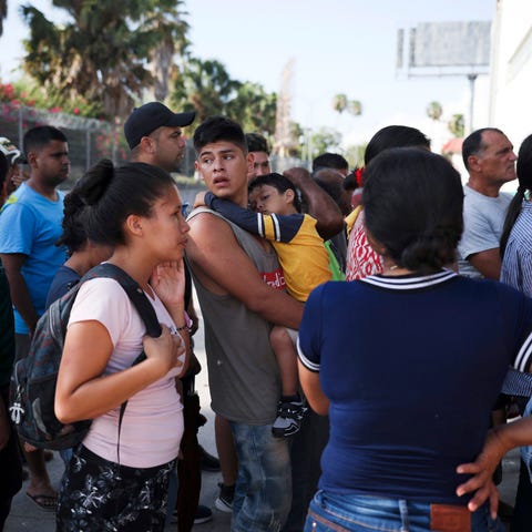 FILE - In this Aug. 1, 2019 file photo, migrants l