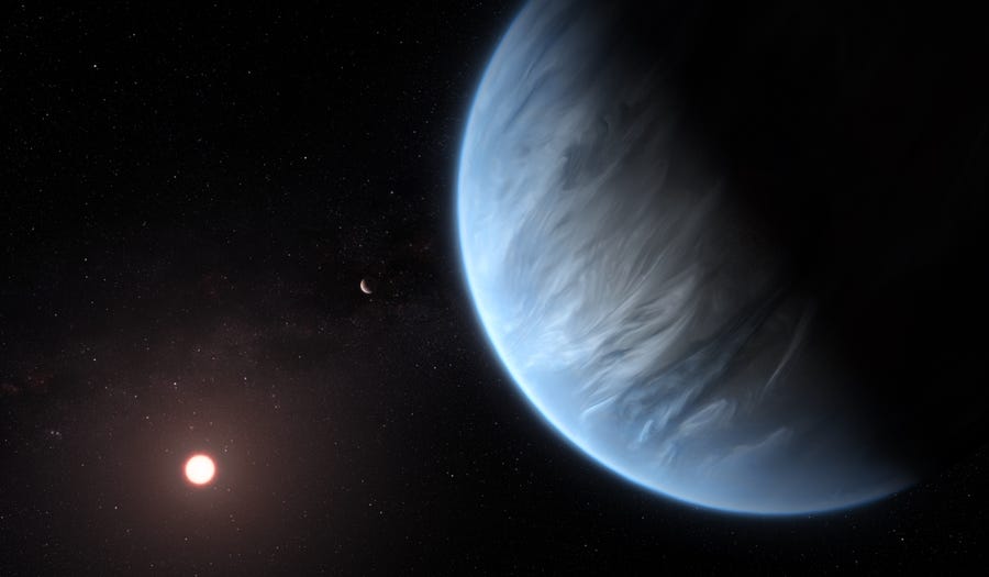 An artist's conception shows the planet K2-18b, its host star and an accompanying planet. K2-18b is now the only super-Earth exoplanet known to host both water and temperatures that could support life.