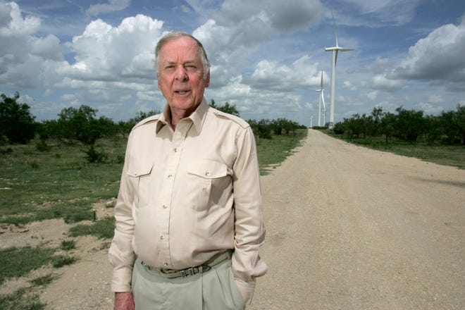 In this USA Today file photo, T. Boone Pickens poses for a portrait in Sweetwater, Texas, with wind turbines in the background. Items from the late Texas and Oklahoma billionaire's estate will be auctioned online Sept. 12-15, 2020.