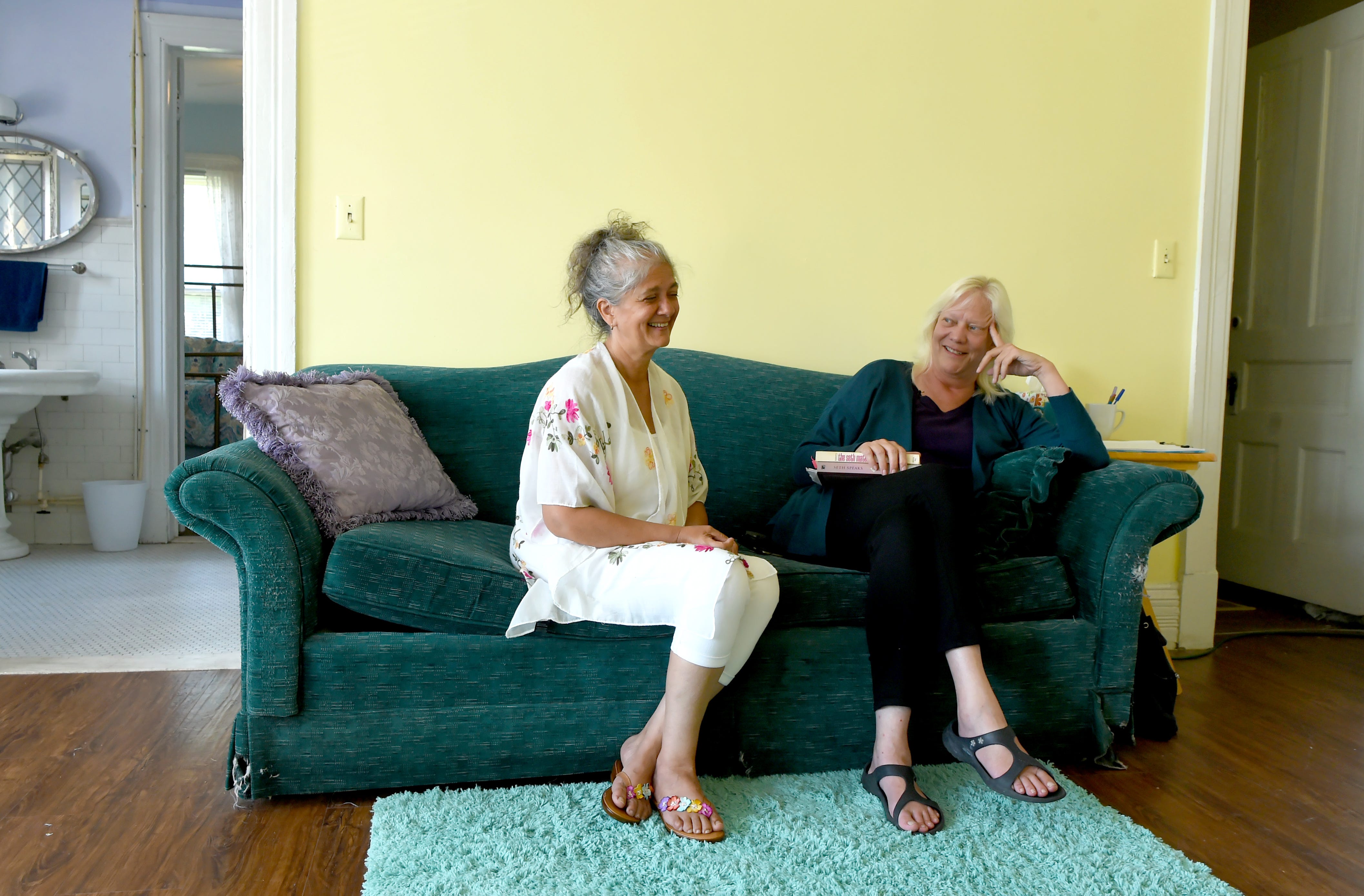 Kate Holton, left, and Oshara Waago, right, in the Elmira apartment where medium Jane Roberts channeled "Seth." Holton and Waago are followers of Seth and hope to turn the apartment building into a learning center dedicated to the teachings of Seth.