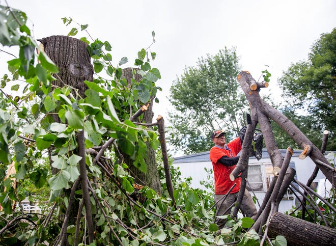 After tornadoes touched down in Sioux Falls, crews clean up Johnson Estates on Thursday, Sept. 12, 2019.