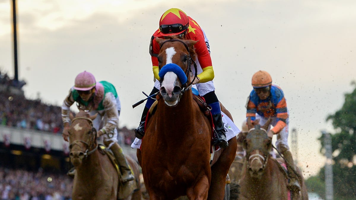 Justify wins the running of the 2018 Belmont Stakes and completes the Triple Crown.
