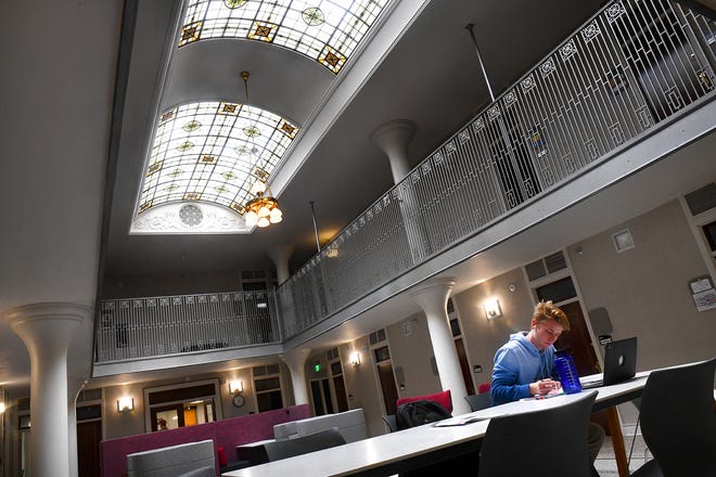 Zach Nagel concentrates on his studies underneath the large skylights in a remodeled space at the historic Main Building Wednesday, Sept. 11, at the College of St. Benedict in St. Joseph. 