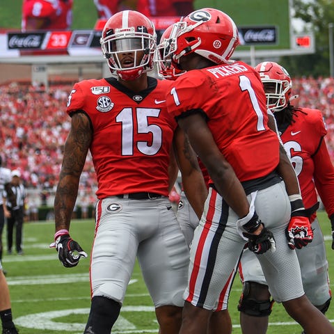 Georgia wide receiver Lawrence Cager (15) celebrat