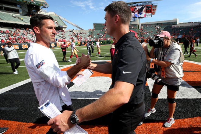 San Francisco 49ers head coach Kyle Shanahan, left, and Cincinnati Bengals head coach Zac Taylor, right, shakes hands at the end of a Week 2 NFL football game, Sunday, Sept. 15, 2019, at Paul Brown Stadium in Cincinnati. 