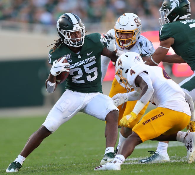 Michigan State Spartans wide receiver Darrell Stewart Jr. is tackled by Arizona State's Evan Fields (4) and Jermayne Lole (90) in the second half Saturday, September 14, 2019 at Spartan Stadium.