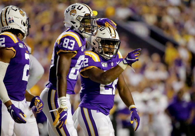 Sep 14, 2019; Baton Rouge, LA, USA; LSU Tigers running back Clyde Edwards-Helaire (22) celebrates with wide receiver Jaray Jenkins (83) during the second quarter against the Northwestern State Demons at Tiger Stadium. Mandatory Credit: Derick E. Hingle-USA TODAY Sports