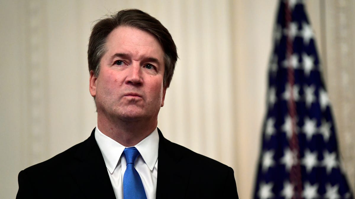 In this Oct. 8, 2018, file photo, Supreme Court Justice Brett Kavanaugh stands before a ceremonial swearing-in in the East Room of the White House in Washington. At least two Democratic presidential candidates, Kamala Harris and Kamala Harris are calling for the impeachment of Supreme Court Justice Brett Kavanaugh in the face of a new, uninvestigated, allegation of sexual impropriety when he was in college.