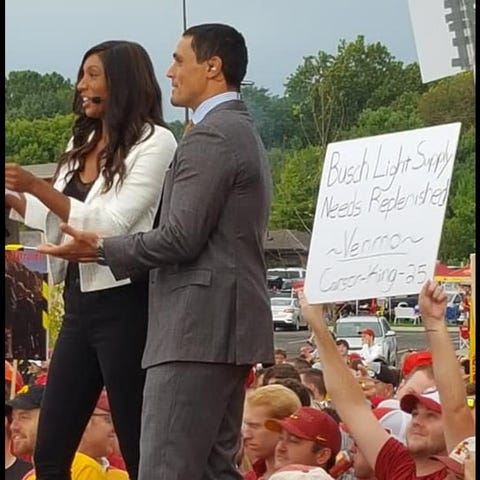 Carson King holds up his "Busch Light Supply Needs