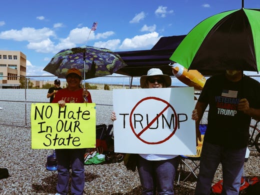 A small group of Donald Trump protesters gather at a designated area outside of the Santa Ana Star Center ahead of the president's rally Monday, Sept. 16, 2019.