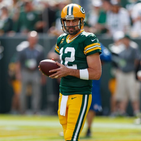 Green Bay Packers quarterback Aaron Rodgers (12) h