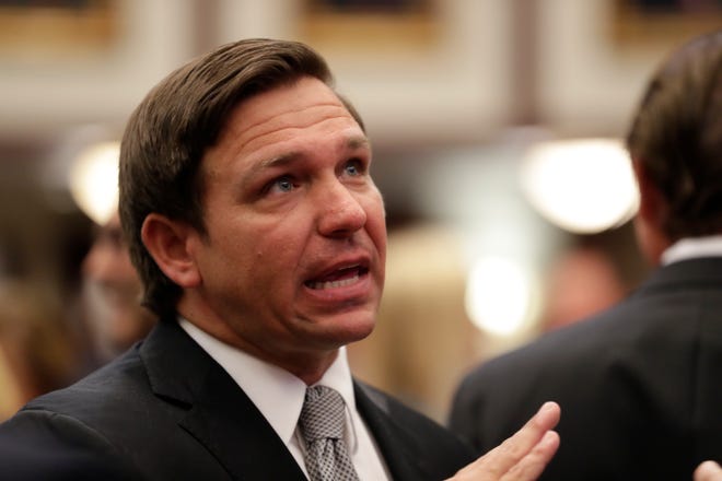 Gov. Ron DeSantis greets members of the House of Representatives during a House Republican Conference meeting where Rep. Chris Sprowls, R-Palm Harbor, was nominated to become the House Speaker after the November 2020 elections.