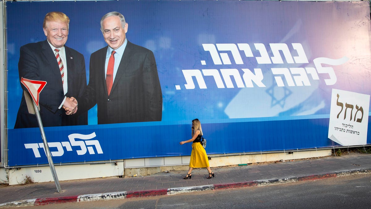 An election campaign billboard for Israeli Prime Minister Benjamin Netanyahu, right, with President Donald Trump, in Tel Aviv, on Sept 15, 2019. In Hebrew, the billboard reads: "Netanyahu, in another league."