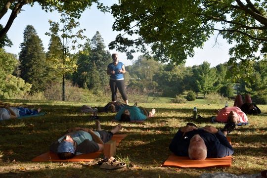 Jessica McCrumb of Otterdance Yogo leads a class at Leila Arboretum on Tuesday, Sept. 17, 2019.