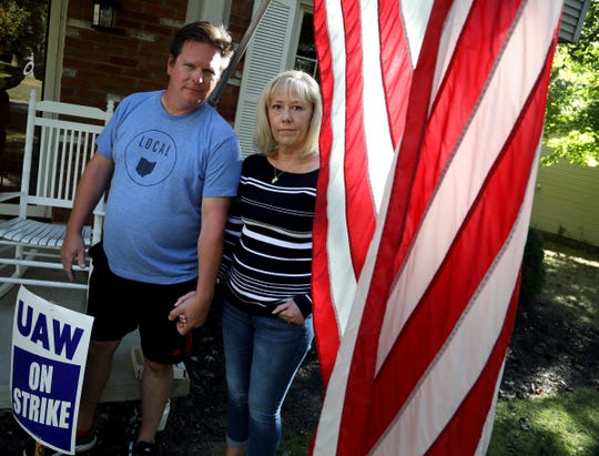 Mike and Sara Yakim in front of their house in Lordstown, Ohio on Wednesday, September 18, 2019. Yakim worked at the Lordstown Assembly where the Chevy Cruze was made until the plant was closed March 8 of this year. He was transferred to the GM Lansing Delta Township in September but with the national wide strike has come back to Lordstown to picket in front of the empty plant in Lordstown with others. 