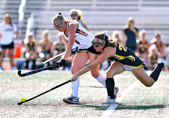 Central York's Emilee Myers, left, and Red Lion's Kennedy Bratton compete for control of the ball during field hockey action at Central York High School in Springettsbury Township, Wednesday, Sept. 18, 2019. Dawn J. Sagert photo