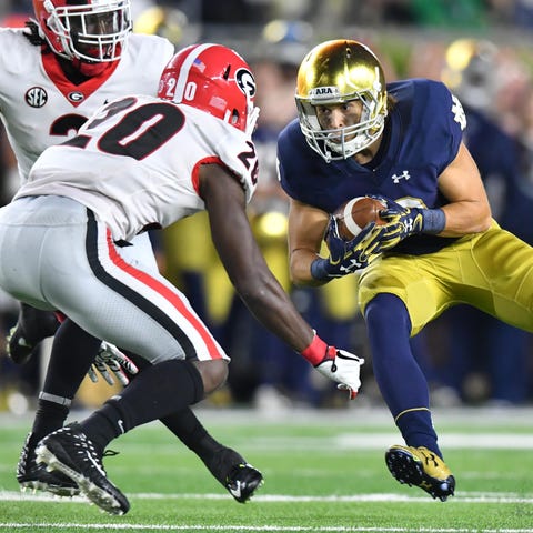 Notre Dame wide receiver Chris Finke carries the b