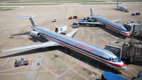 American Airlines MD-80 jets await some of their l