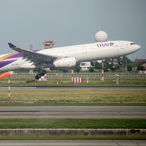 A Thai Airways Airbus A330 lifts off from Bangkok 