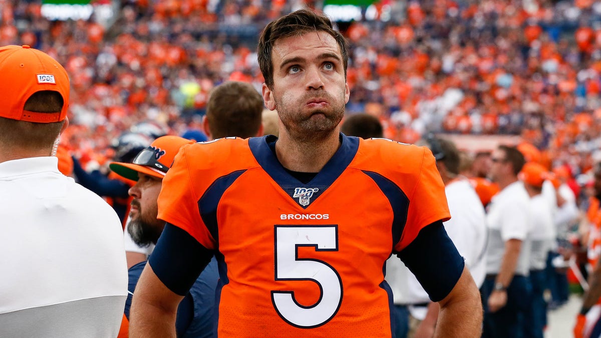 Denver Broncos quarterback Joe Flacco (5) reacts on the sidelines in the fourth quarter against the Chicago Bears at Empower Field at Mile High.
