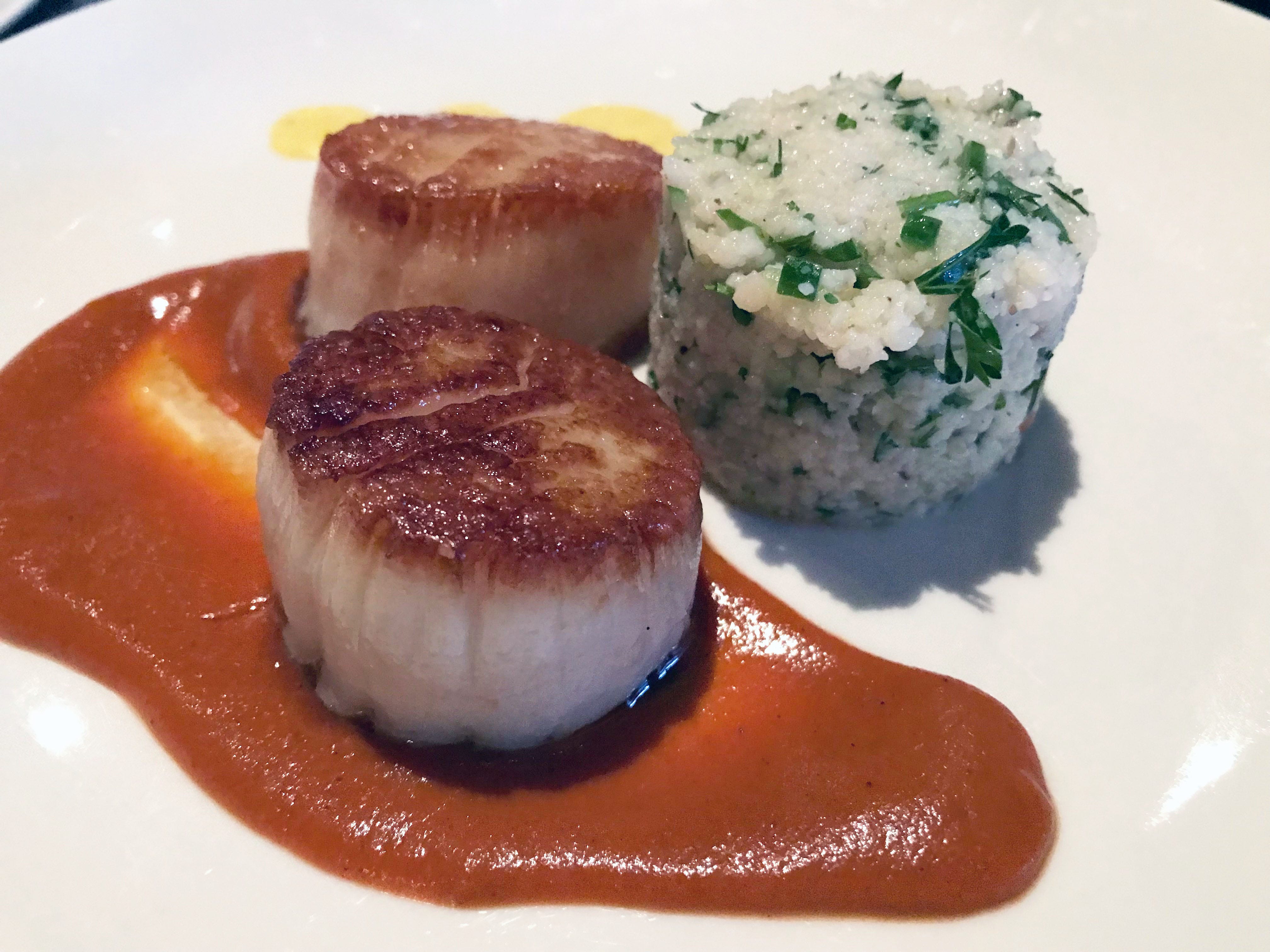 Scallops with tabbouleh are an appetizer at Mistral, 2473 S. Kinnickinnic Ave. It's served with a Libyan sauce of spices and tomato, and with saffron lemon curd.