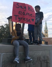 Akleemah Gardner, 8, of Racine holds a sign Wednesday  outside the Racine County Courthouse in support of Tyrese West, who was shot and killed by Sgt. Eric Giese of the Mount Pleasant Police Department.