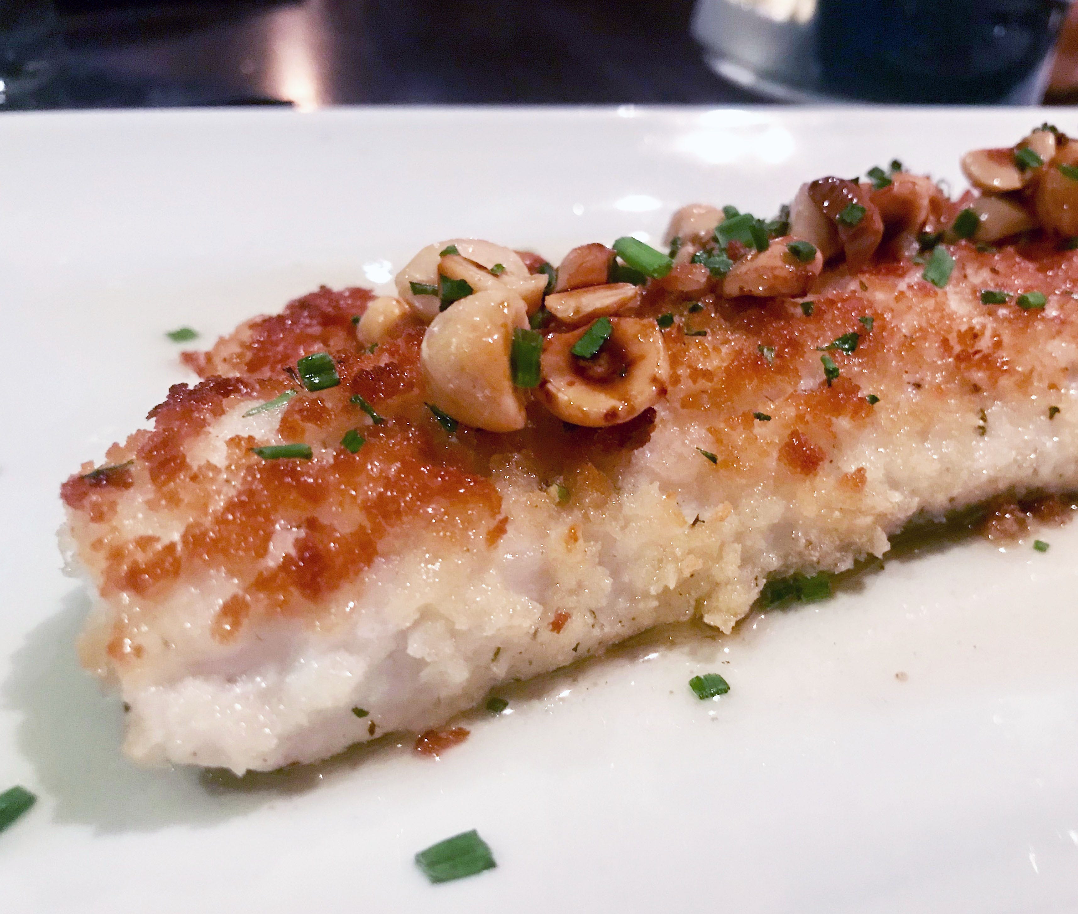 Walleye is crusted in panko crumbs and topped with hazelnuts at Jake's in Pewaukee. Lemon-butter sauce accompanies it.