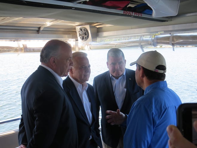 From left, New Jersey Senate President Stephen Sweeney, with senators Joseph  Pennacchio and Oroho aboard the Lake Hopatcong Foundation's Floating Classroom, speaking to foundation president Marty Kane about algae blooms that prevented swimming there for most of the summer. Sept. 19, 2019.