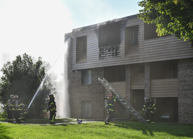 St. Cloud firefighters respond to an apartment fire on 15th Street North Thursday, Sept. 19, 2019, in St. Cloud. 