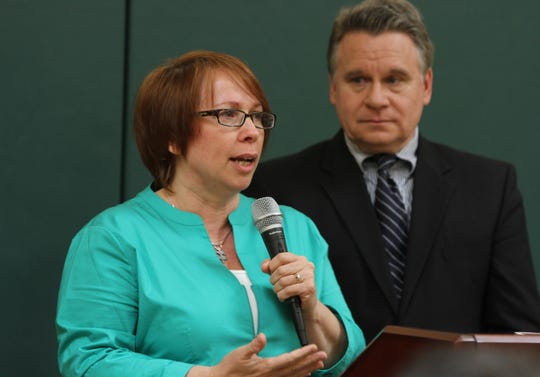 In 2014, Bobbie Gallagher of Brick speaks about raising two children with autism. Rep. Chris Smith is in the background.