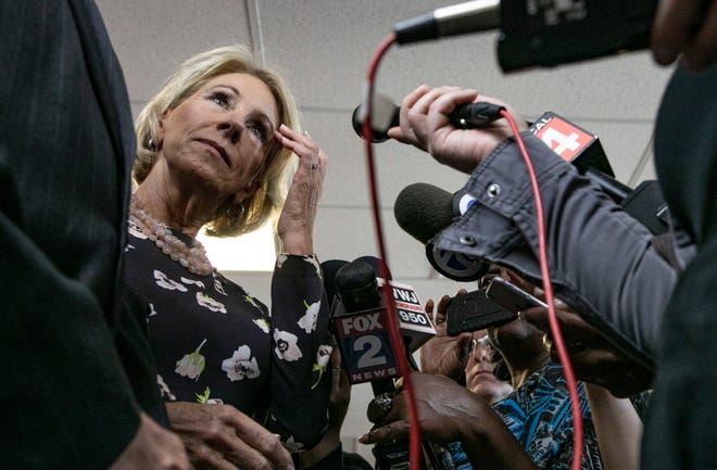 United States Secretary of Education Betsy DeVos answers some questions from the media as she tours Detroit Edison Public School Academy in Detroit Friday, Sept. 20, 2019.