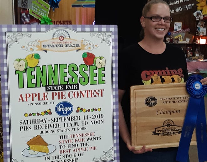 Samantha Sortino of Murfreesboro stands with the blue ribbon she won at the 2019 Tennessee State Fair for her apple pie recipe.