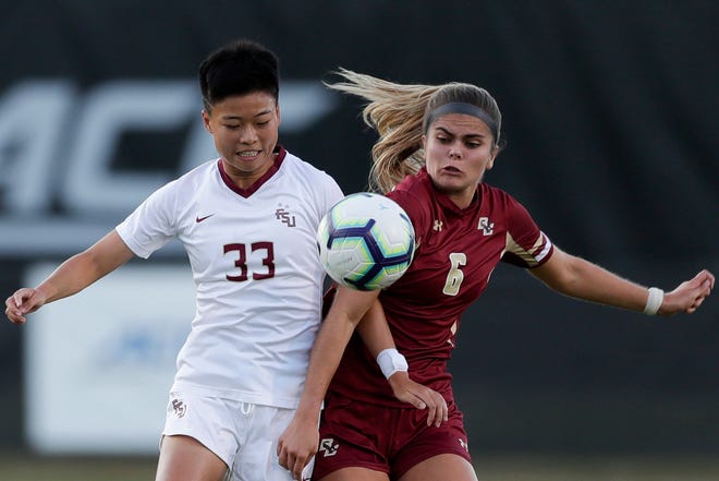 Florida State University Seminoles midfielder Yujie Zhao (33) battles with an opponent during a game between FSU and Boston College at the Seminole Soccer Complex Thursday, Sept. 19, 2019. 