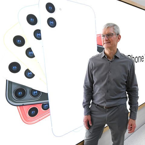 CEO Tim Cook greets shoppers inside the store.  