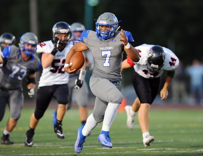 Tyler Cruz (7) of Cedar Crest heads down field on a long touchdown run early in the first quarter of action.
