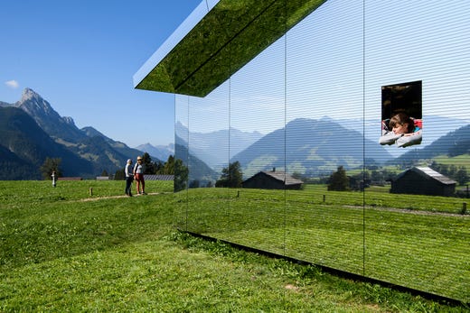 Stefanie visits the art installation called 'Mirage Gstaad' by American artist Doug Aitken in Gstaad, Switzerland, Saturday, Sept. 21, 2019. This structure was presented during the exposition 'Elevation 1049: Frequencies'. It will be visible until spring 2021. (Anthony Anex/Keystone via AP) ORG XMIT: KSOB123