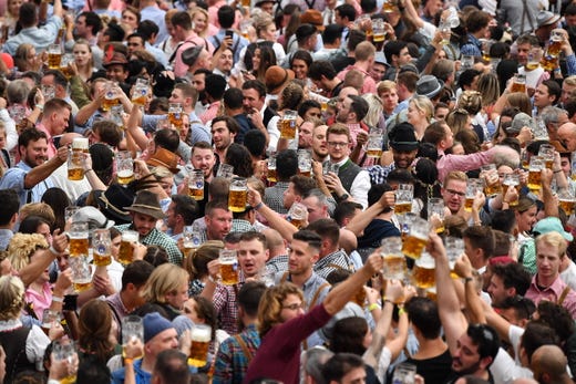 Visitors celebrate at the Hofbraeu tent during the opening day of the 186th Oktoberfest beer festival on the Theresienwiese in Munich, Germany on Sept. 21, 2019. The Munich Beer Festival is the world's largest traditional beer festival.