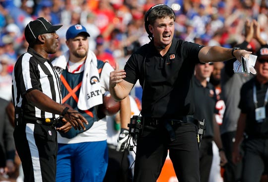 Cincinnati Bengals head coach Zac Taylor argues for a safety after Buffalo Bills cornerback Tre'Davious White (27) intercepted a pass intended for wide receiver Auden Tate (19) late in the fourth quarter of the NFL Week 3 game between the Buffalo Bills and the Cincinnati Bengals at New Era Stadium in Buffalo, N.Y., on Sunday, Sept. 22, 2019. The Bengals remain winless after a late interception ended a Bengals drive and sealed the win for Buffalo. 