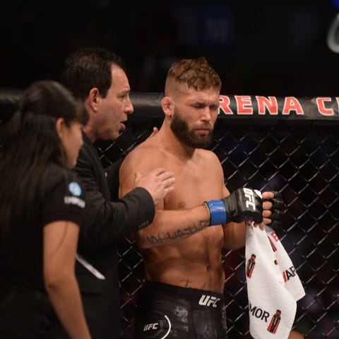 Jeremy Stephens reacts after being poked in the ey