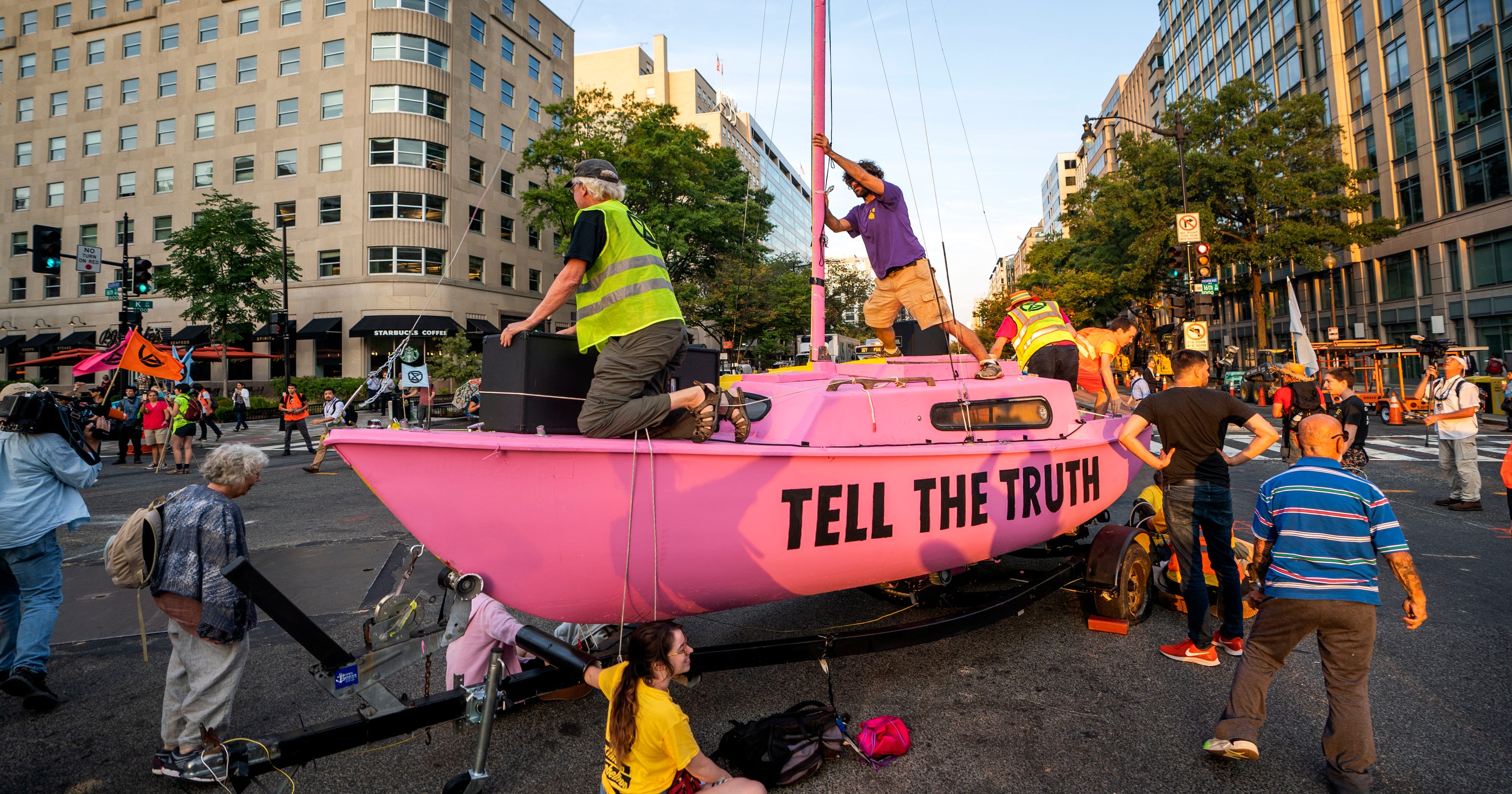 Climate change activists 'shut down D.C.' and disrupt morning commutes at busy intersections - USA TODAY