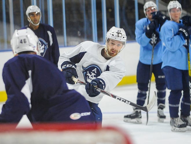 Center Tommy Novak, a River Falls native who played in three games for the Admirals last season, fires a shot on the opening day of  training camp Tuesday at the UW-Milwaukee Panther Arena.