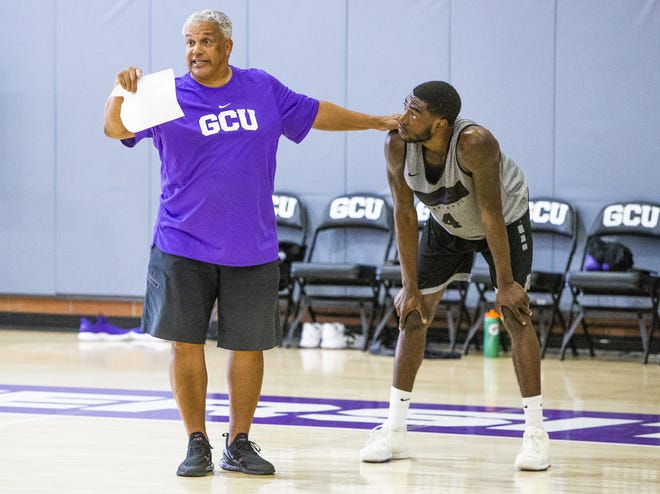 The Grand Canyon University basketball team practices at the school, Tuesday, September 24, 2019. Associate Head Coach Marvin Menzies instructs forward Oscar Frayer.