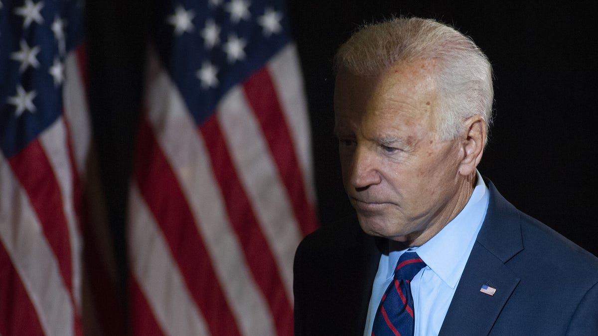 Former Vice President Joe Biden exits the stage after making remarks about revelations that President Donald Trump asked Ukraine to investigate him,
