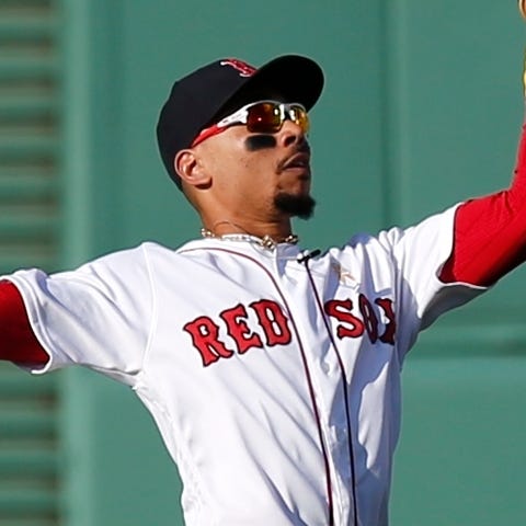 Boston Red Sox's Mookie Betts makes the catch on t